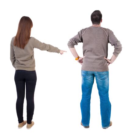 Back view of couple in sweater with mobile phone. beautiful friendly girl and guy together. Rear view people collection. backside view of person. Isolated over white background.の写真素材