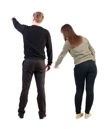 Back view of couple in sweater with mobile phone. beautiful friendly girl and guy together. Rear view people collection. backside view of person. Isolated over white background.の写真素材