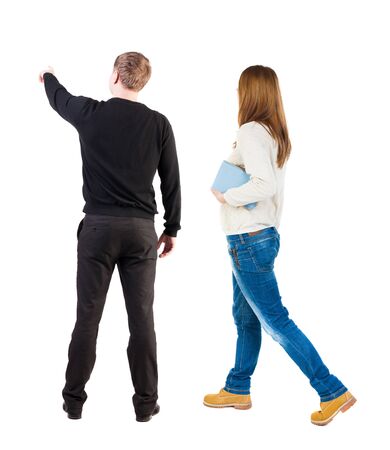 Back view of couple in sweater with mobile phone. beautiful friendly girl and guy together. Rear view people collection. backside view of person. Isolated over white background.の写真素材