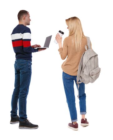 Back view couple with laptop in sweater. beautiful man and woman. Rear view people collection. backside view of person. Isolated over white background.の写真素材