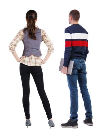 Back view couple with laptop in sweater. beautiful man and woman. Rear view people collection. backside view of person. Isolated over white background.の写真素材