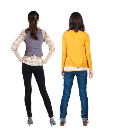 Back view of two woman in sweater. Rear view people collection. backside view of person. Isolated over white background.の写真素材