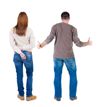 Back view of couple in sweater showing thumbs up. beautiful woman and man together. Rear view people collection. backside view of person. Isolated over white background.の写真素材