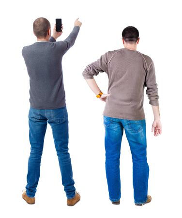 Back view of two man in sweater with mobile phone. Rear view people collection. backside view of person. Isolated over white background.の写真素材
