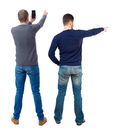 Back view of two man in sweater with mobile phone. Rear view people collection. backside view of person. Isolated over white background.の写真素材
