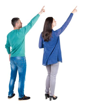 Back view of couple in sweater with mobile phone. beautiful friendly girl and guy together. Rear view people collection. backside view of person. Isolated over white background.の写真素材