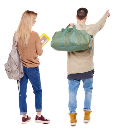 Back view of couple in sweater with mobile phone. beautiful friendly girl and guy together. Rear view people collection. backside view of person. Isolated over white background.の写真素材