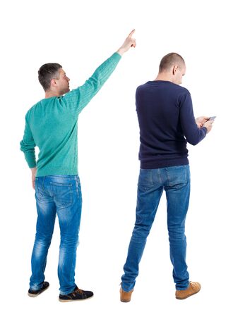 Back view of two man in sweater with mobile phone. Rear view people collection. backside view of person. Isolated over white background.の写真素材