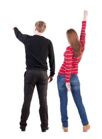Back view of couple in sweater with mobile phone. beautiful friendly girl and guy together. Rear view people collection. backside view of person. Isolated over white background.の写真素材
