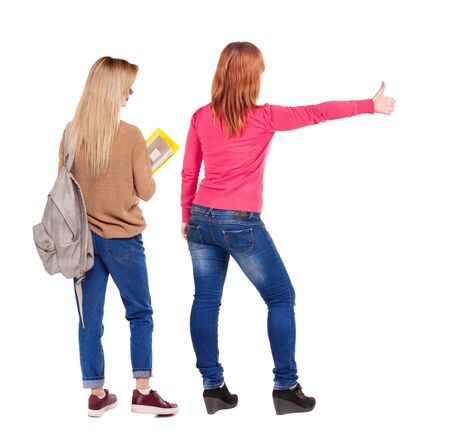 Back view of couple in sweater showing thumbs up. beautiful woman and man together. Rear view people collection. backside view of person. Isolated over white background.の写真素材