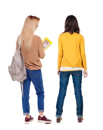 Back view of two woman in sweater. Rear view people collection. backside view of person. Isolated over white background.の写真素材