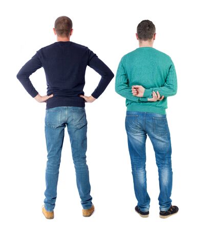 Back view of two man in sweater pointing. Rear view people collection. backside view of person. Isolated over white background.の写真素材