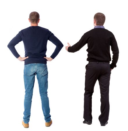 Back view of two man in sweater pointing. Rear view people collection. backside view of person. Isolated over white background.の写真素材