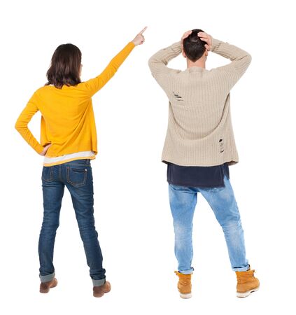 Back view of couple in sweater with mobile phone. beautiful friendly girl and guy together. Rear view people collection. backside view of person. Isolated over white background.の写真素材