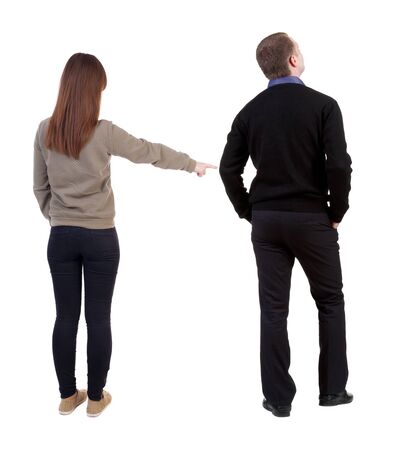 Back view of couple in sweater with mobile phone. beautiful friendly girl and guy together. Rear view people collection. backside view of person. Isolated over white background.の写真素材