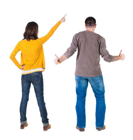 Back view of couple in sweater with mobile phone. beautiful friendly girl and guy together. Rear view people collection. backside view of person. Isolated over white background.の写真素材