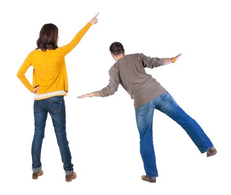 Back view of couple in sweater with mobile phone. beautiful friendly girl and guy together. Rear view people collection. backside view of person. Isolated over white background.の写真素材