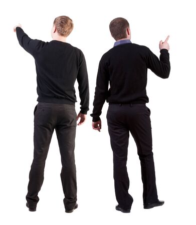 Back view of two man in sweater pointing. Rear view people collection. backside view of person. Isolated over white background.の写真素材