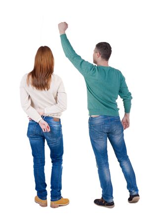 Back view of couple in sweater with mobile phone. beautiful friendly girl and guy together. Rear view people collection. backside view of person. Isolated over white background.の写真素材