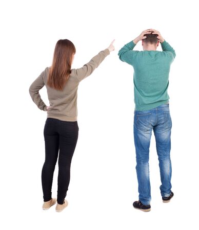 Back view of couple in sweater with mobile phone. beautiful friendly girl and guy together. Rear view people collection. backside view of person. Isolated over white background.の写真素材