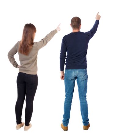 Back view of couple in sweater with mobile phone. beautiful friendly girl and guy together. Rear view people collection. backside view of person. Isolated over white background.の写真素材