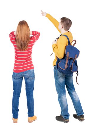 Back view of couple in sweater with mobile phone. beautiful friendly girl and guy together. Rear view people collection. backside view of person. Isolated over white background.の写真素材