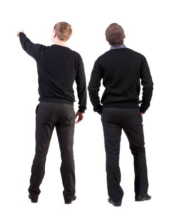 Back view of two man in sweater pointing. Rear view people collection. backside view of person. Isolated over white background.の写真素材