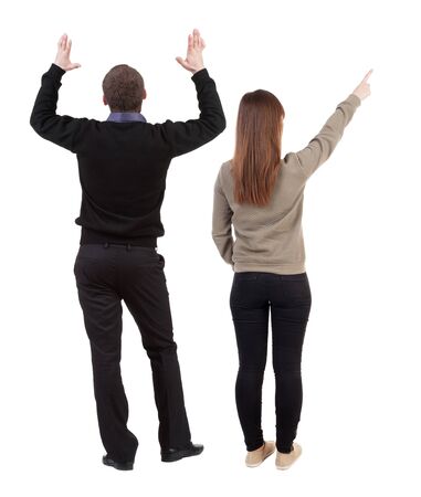 Back view of couple in sweater with mobile phone. beautiful friendly girl and guy together. Rear view people collection. backside view of person. Isolated over white background.の写真素材
