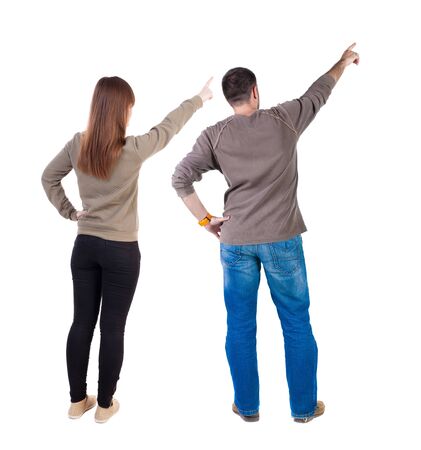 Back view of couple in sweater with mobile phone. beautiful friendly girl and guy together. Rear view people collection. backside view of person. Isolated over white background.の写真素材