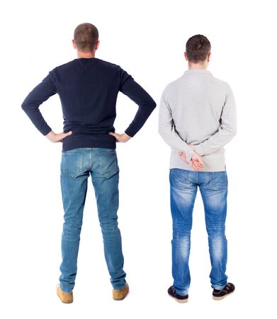 Back view of two man in sweater pointing. Rear view people collection. backside view of person. Isolated over white background.の写真素材