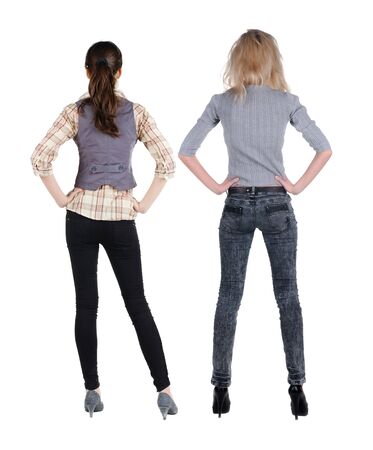 Back view of two woman in sweater. Rear view people collection. backside view of person. Isolated over white background.の写真素材