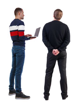 Back view two man in sweater with laptop. Rear view people collection. backside view of person. Isolated over white background. Guys looking forwardの写真素材