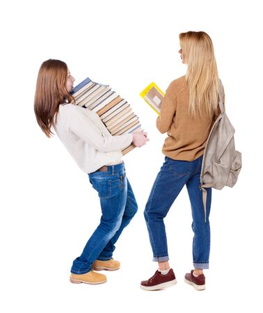 Back view of two woman in sweater. Rear view people collection. backside view of person. Isolated over white background.の写真素材