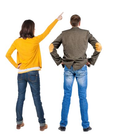 Back view of couple in sweater with mobile phone. beautiful friendly girl and guy together. Rear view people collection. backside view of person. Isolated over white background.の写真素材