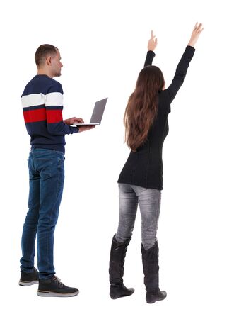 Back view couple with laptop in sweater. beautiful man and woman. Rear view people collection. backside view of person. Isolated over white background.の写真素材