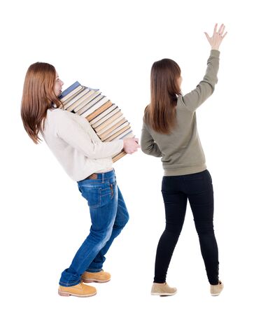 Back view of two young woman photographed on a mobile phone in sweater. Rear view people collection. backside view of person. Rear view. Isolated over white background.の写真素材