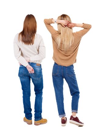 Back view of two woman in sweater. Rear view people collection. backside view of person. Isolated over white background.の写真素材