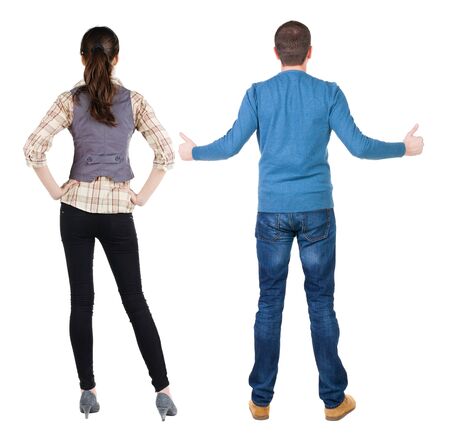 Back view of couple in sweater showing thumbs up. beautiful woman and man together. Rear view people collection. backside view of person. Isolated over white background.の写真素材
