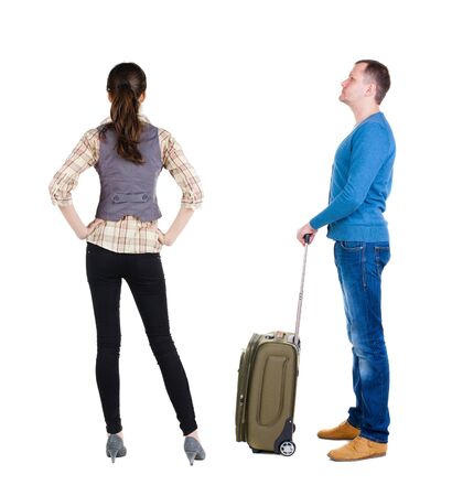young couple in sweater traveling with suitcas. Back view. Rear view people collection. backside view of person. Isolated over white background.の写真素材