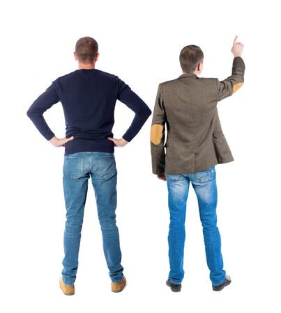 Back view of two man in sweater pointing. Rear view people collection. backside view of person. Isolated over white background.の写真素材