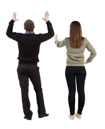 Back view of couple in sweater showing thumbs up. beautiful woman and man together. Rear view people collection. backside view of person. Isolated over white background.の写真素材