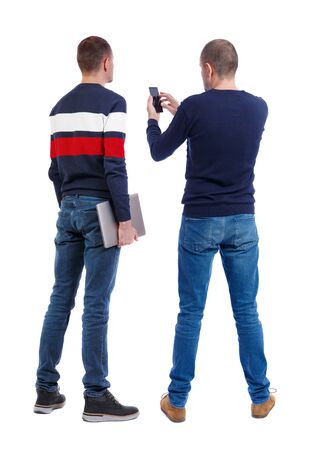Back view of two man in sweater with mobile phone. Rear view people collection. backside view of person. Isolated over white background.の写真素材