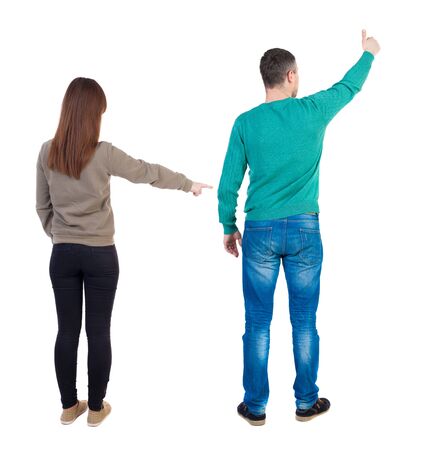 Back view of couple in sweater with mobile phone. beautiful friendly girl and guy together. Rear view people collection. backside view of person. Isolated over white background.の写真素材