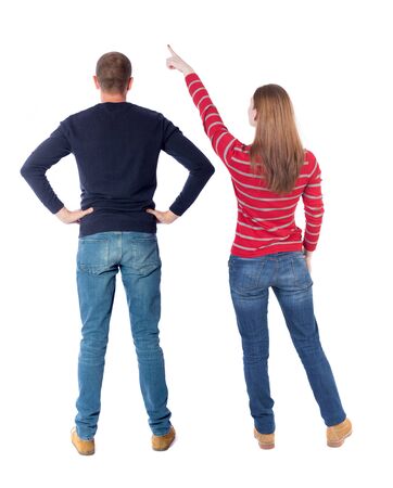 Back view of couple in sweater with mobile phone. beautiful friendly girl and guy together. Rear view people collection. backside view of person. Isolated over white background.の写真素材