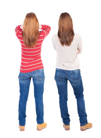 Back view of two woman in sweater. Rear view people collection. backside view of person. Isolated over white background.の写真素材