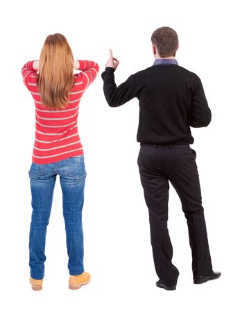 Back view of couple in sweater with mobile phone. beautiful friendly girl and guy together. Rear view people collection. backside view of person. Isolated over white background.の写真素材