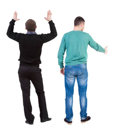 Back view two man in sweater showing thumb up. Rear view people collection. backside view of person. Isolated over white background.の写真素材