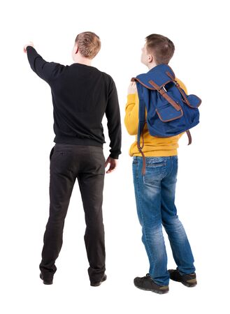 Back view of two man in sweater pointing. Rear view people collection. backside view of person. Isolated over white background.の写真素材