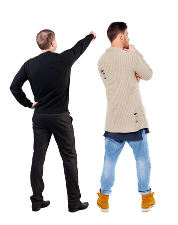 Back view of two man in sweater pointing. Rear view people collection. backside view of person. Isolated over white background.の写真素材