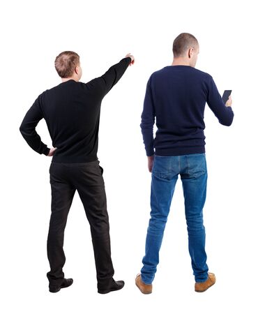 Back view of two man in sweater with mobile phone. Rear view people collection. backside view of person. Isolated over white background.の写真素材